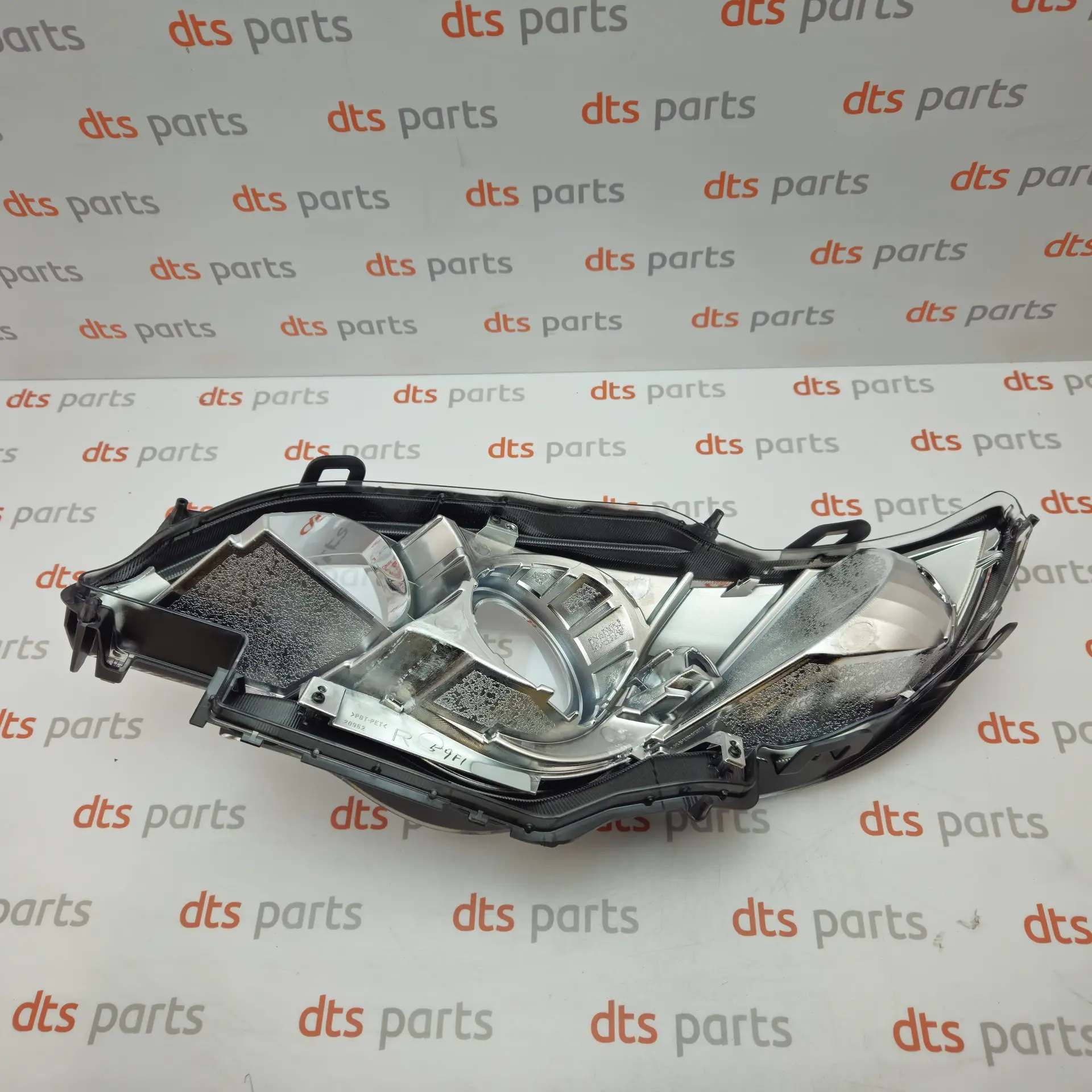 OEM Subaru 84990AG560 – Front right headlight lens exension