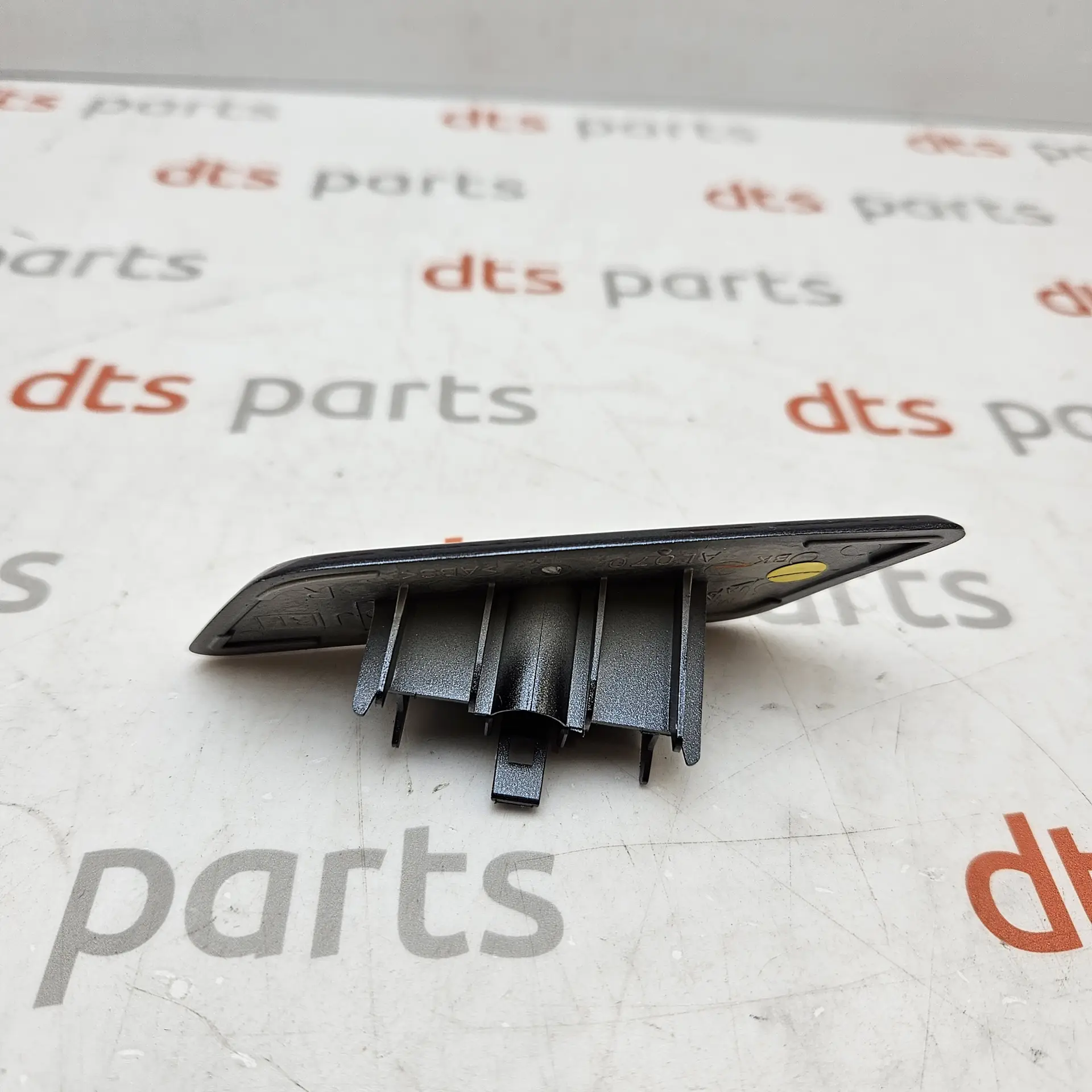 OEM Subaru 86636AL070EN – Front right headlight nozzle cover