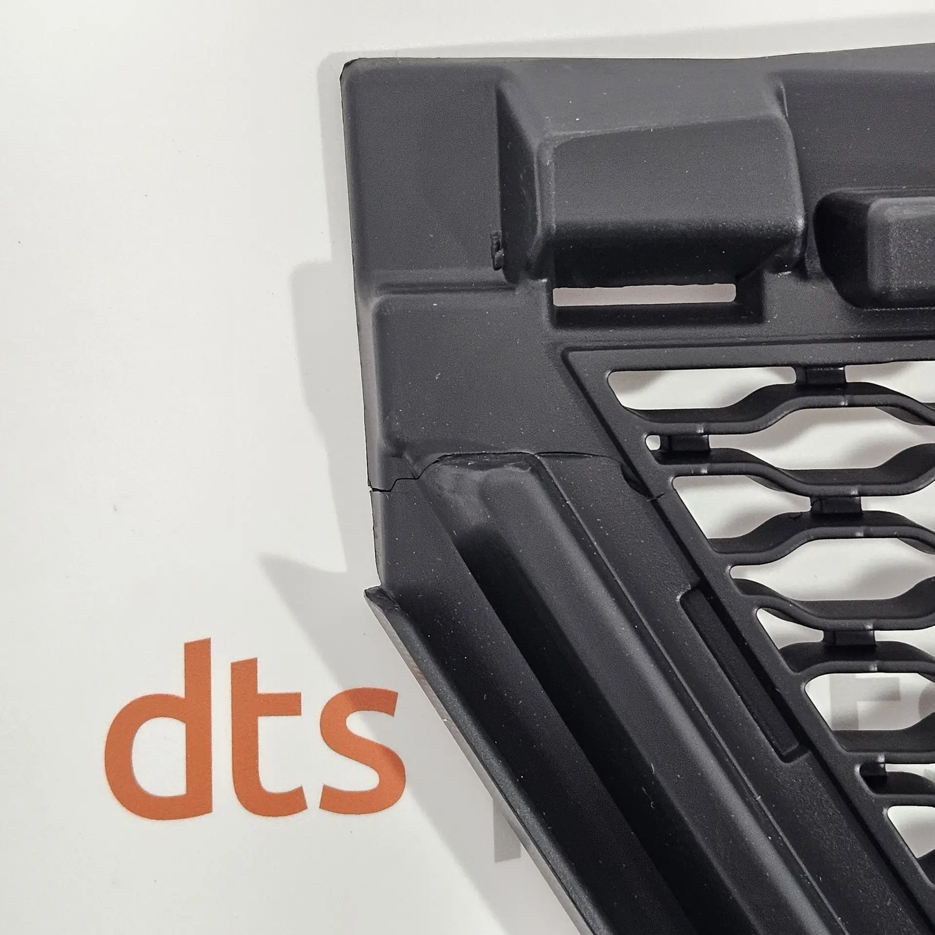 OEM Land Rover LR138283 – Front Bumper Lower Grille with a small defect