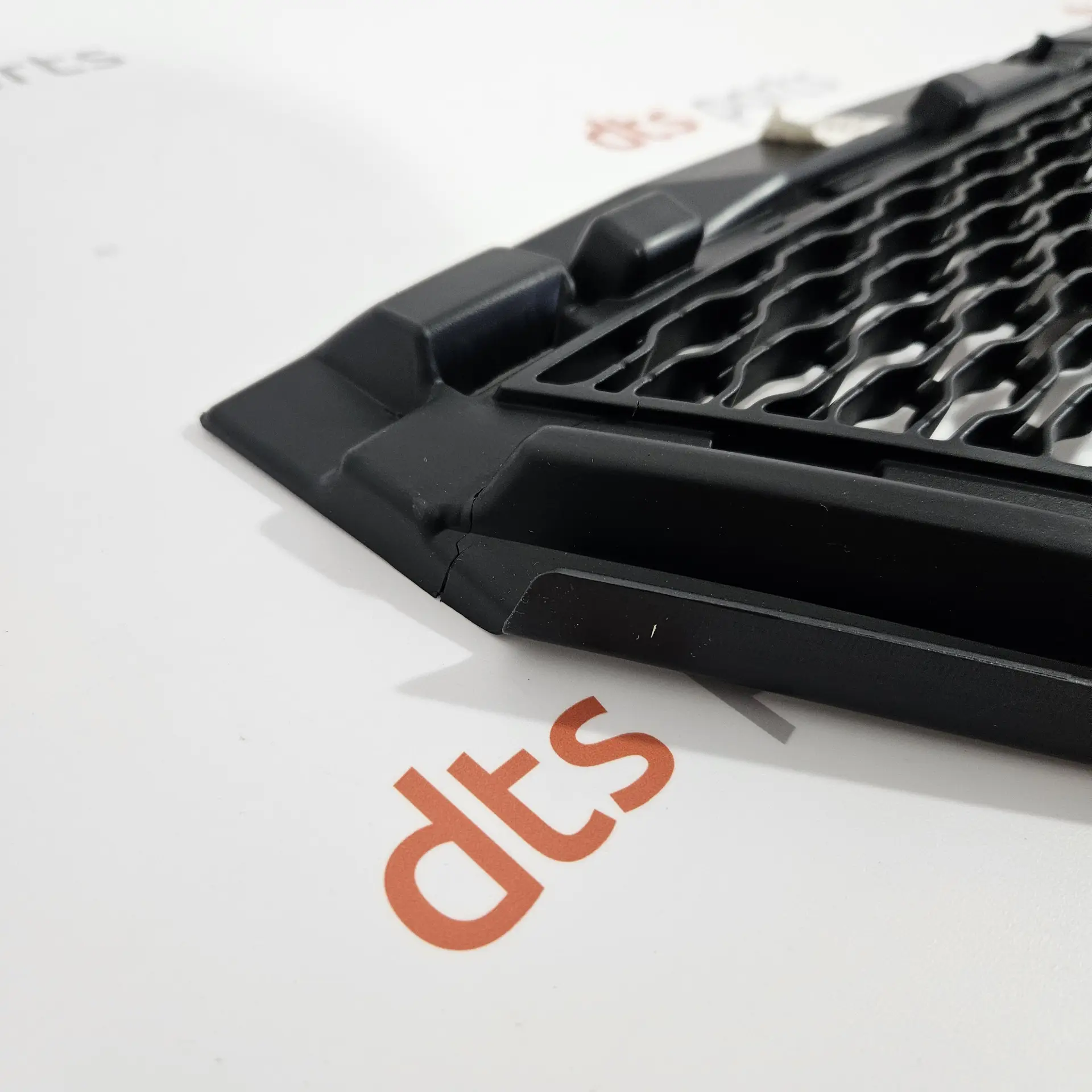 OEM Land Rover LR138283 – Front Bumper Lower Grille with a small defect